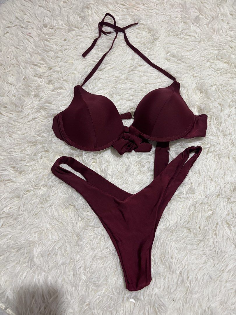 Maroon Two-Piece Halter Bikini Swimsuit (Category: Bikinis & Swimsuits) located in Quezon City. Submitted by lovedbysloane (Listing ID 1468598797, Image 1). Description: - Color: Deep burgundy / maroon - Style: Two-piece bikini set - Top details: Molded underwire cups, halter neck ties, knotted center front - Bottom details: High-cut leg, double-strap sides - Condition: Excellent, clean, and undamaged - Ideal for: Beach, pool, and resort wear.