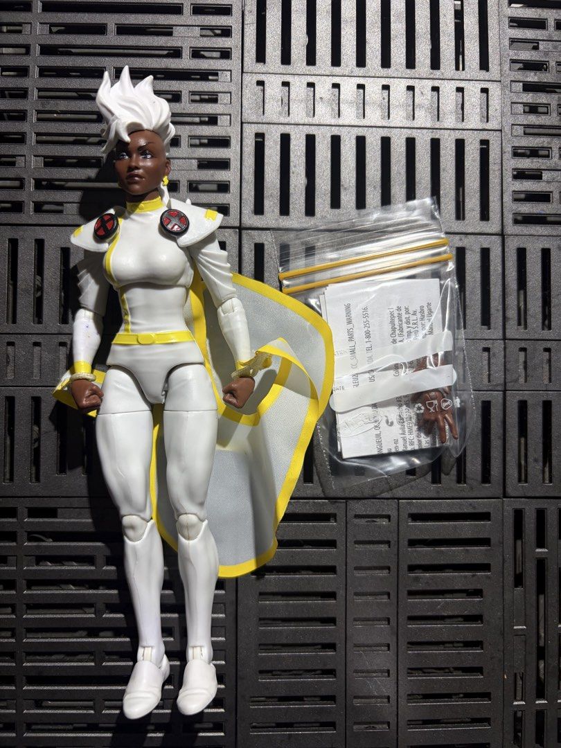 Marvel Legends Storm X-Men 97 Action Figure (Category: Figurines & Statues) located in Quezon City. Submitted by KRC07 (Listing ID 1468503482, Image 1). Description: - Character: Marvel Legends X-Men 97 Storm in classic white and yellow costume - Size: 6-inch scale with detailed white hair sculpt and cape - Articulation: Fully articulated body with clean paint applications - Accessories: Includes extra interchangeable hands in a small baggie and 