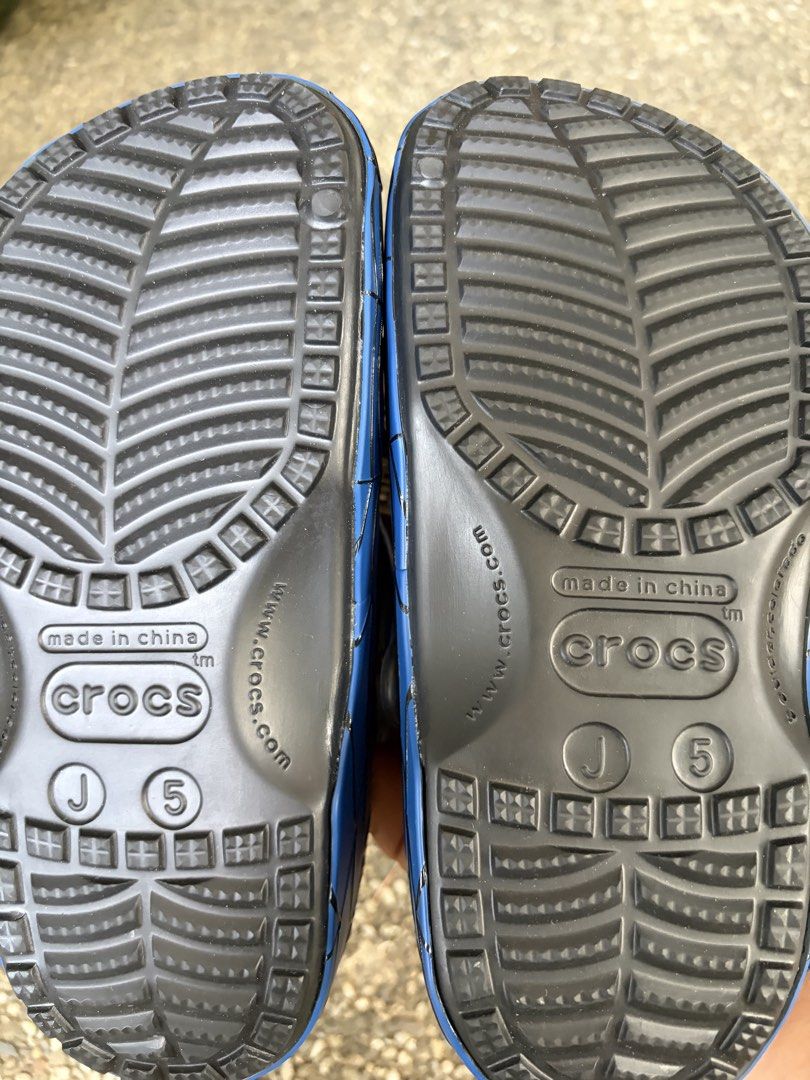 Marvel Spider-Man Crocs size J5 (Brand New) (Category: Babies & Kids Fashion) located in Paranaque City. Submitted by uliman04 (Listing ID 1468517664, Image 2). Description: - Brand: Marvel x Crocs Spider-Man Clogs - Size: Kids J5 - Condition: Brand new, zero tread wear, original Marvel hang tag attached - Design: Red upper with black spider web graphic and blue pivoting heel straps - Features: Includes official Spider-Man Jibbitz charms and blac