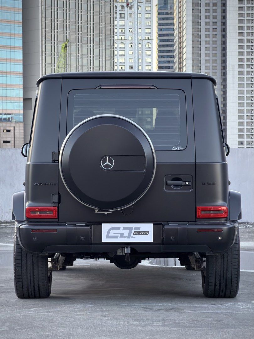 Mercedes-Benz G63 AMG Auto (Category: Used Cars) located in Pasig City. Submitted by gtautoph (Listing ID 1468563243, Image 2). Description: 2021 Mercedes Benz G63 AMG AMG Night Package 22k Kilometers ONLY Matte Black Full Body Wrap (Black Metallic Original Color) 4.0L V8 Biturbo AMG Petrol Engine 577 HP 850 Nm of Torque AMG SPEEDSHIFT TCT 9-Speed Automatic Transmission Diamond Stitched Red Leather Interior Ventilated Seats 12” Digital Instrument