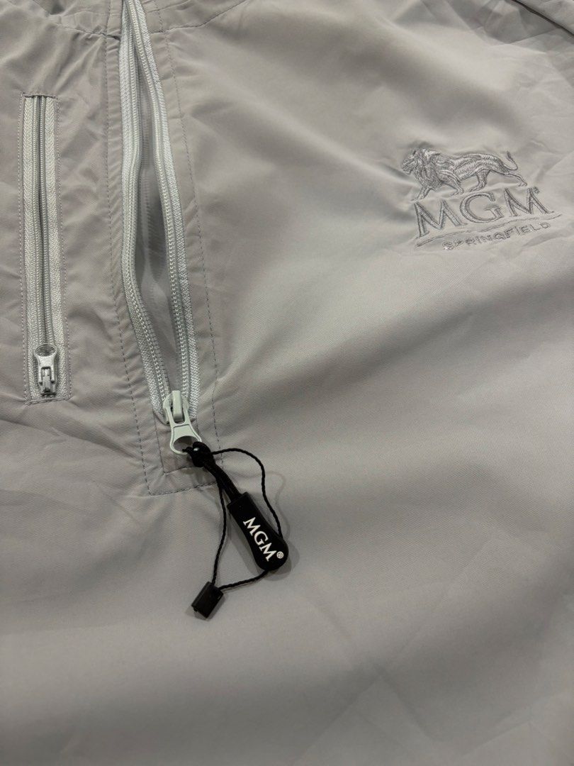 MGM SPRINGFIELD HALF-ZIP PULLOVER (Category: Coats, Jackets and Outerwear) located in Alburquerque. Submitted by ukay_ni_edgar (Listing ID 1468572202, Image 3). Description: Minimalist vintage style with a clean, neutral aesthetic. This light grey MGM Springfield pullover features embroidered branding, a stand-up collar, and a sleek half-zip design — perfect for effortless everyday fits..