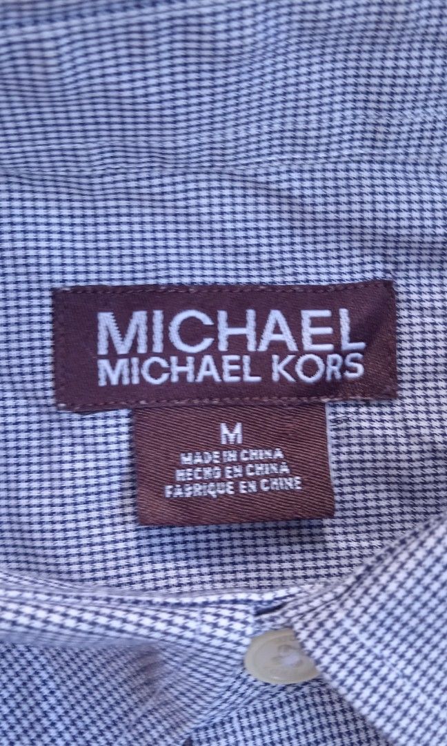 Michael Kors botton down long sleeve (Category: Formal Shirts) located in Davao. Submitted by lee_ly (Listing ID 1468523245, Image 2). Description: Excellent condition dual chest flap pockets color: Light blue color rate:9.5/10 size:medium dimes:22.5*28 color may due to lighting.