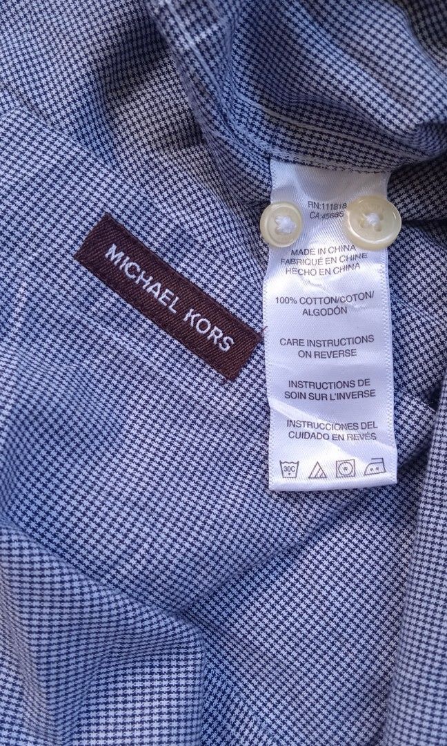 Michael Kors botton down long sleeve (Category: Formal Shirts) located in Davao. Submitted by lee_ly (Listing ID 1468523245, Image 3). Description: Excellent condition dual chest flap pockets color: Light blue color rate:9.5/10 size:medium dimes:22.5*28 color may due to lighting.