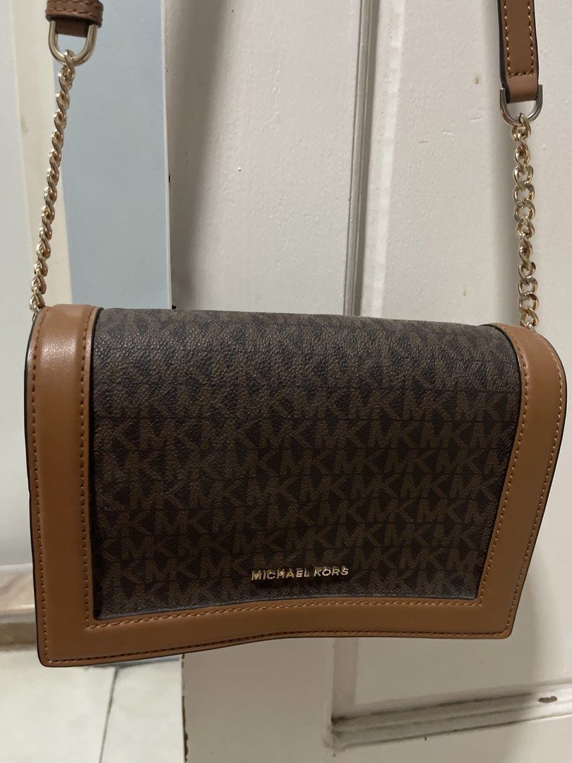 Michael Kors Brown Monogram Crossbody Bag (Category: Luxury Bags & Wallets) located in Manila. Submitted by zianreyy (Listing ID 1468529233, Image 3). Description: - Authentic Michael Kors crossbody bag - Includes an adjustable leather shoulder strap for a custom fit - Used once, perfect condition no issues location: Taguig / Caloocan reason for selling: im not using it anymore, decluttering .