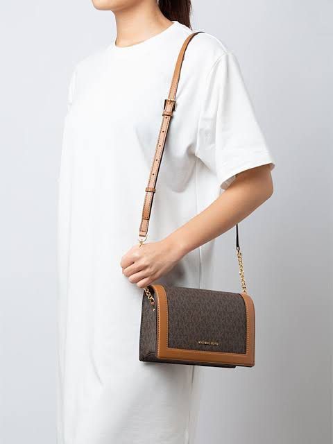 Michael Kors Brown Monogram Crossbody Bag (Category: Luxury Bags & Wallets) located in Manila. Submitted by zianreyy (Listing ID 1468529233, Image 2). Description: - Authentic Michael Kors crossbody bag - Includes an adjustable leather shoulder strap for a custom fit - Used once, perfect condition no issues location: Taguig / Caloocan reason for selling: im not using it anymore, decluttering .