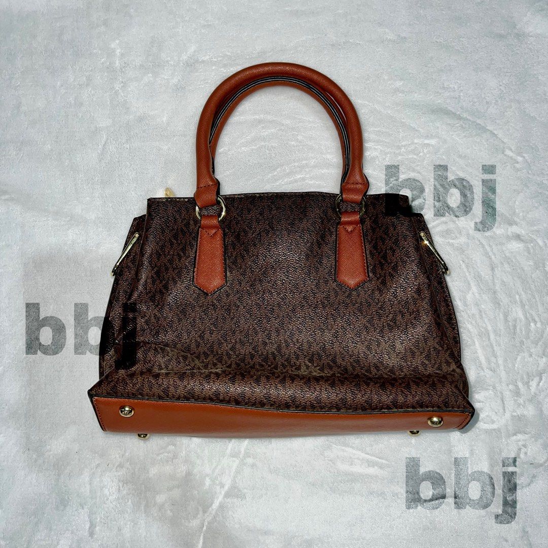 Michael Kors Brown Monogram Satchel Handbag (Category: Luxury Bags & Wallets) located in Manila. Submitted by jojobbj99 (Listing ID 1468641528, Image 3). Description: Michael Kors Monogram Satchel RFS: received as a gift, not my type ✅ Clean, 3 multi-compartment with zip pocket 👜 Inclusions: Strap, MK charm ✅ Brown monogram, tan leather trim ✅ Gold-tone with bottom feet 📍Location: Upper Antipolo City, Rizal Delivery: Lalamove / Grab (buyer hand