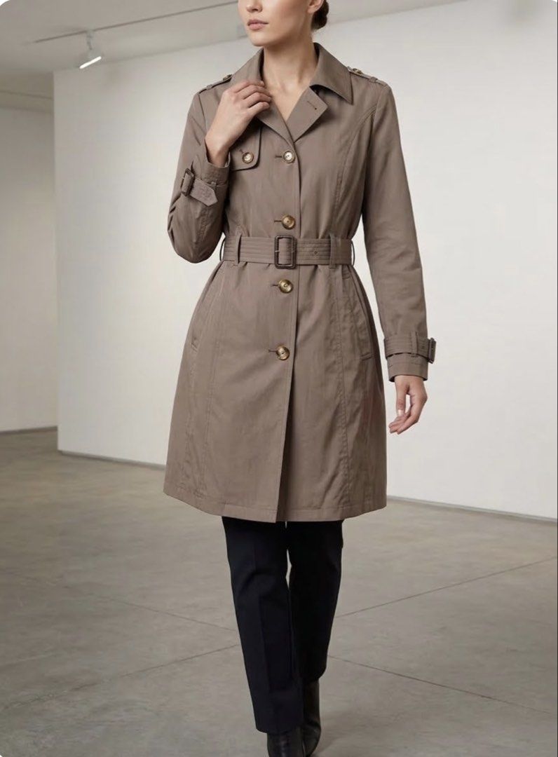 Michael Kors Brown Trench Coat (Category: Coats, Jackets and Outerwear) located in Mataasnakahoy. Submitted by zero4thrift (Listing ID 1468559482, Image 2). Description: - Brand: Michael Kors - Color: Brown - Style: Mid-length trench coat, great for cooler weather - Closure: Front tortoise-shell buttons - Details: Classic collar, shoulder epaulets, and cuff straps - Belt: Matching waist belt with a dark buckle included Actual size - 21” width - 3