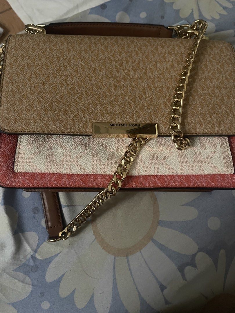 Michael Kors Multicolor Monogram Shoulder Bag (Category: Luxury Bags & Wallets) located in Manila. Submitted by truetiger.46b87f (Listing ID 1468709321, Image 3). Description: - Brand: Michael Kors - Design: Tri-color monogram print (Brown, Cream, Pink) - Hardware: Gold-tone with chain strap and clasp closure - Closure: Magnetic snap buttons under front flap - Interior: Clean brown leather lining - Inclusion: Original care card - Condition: Excel
