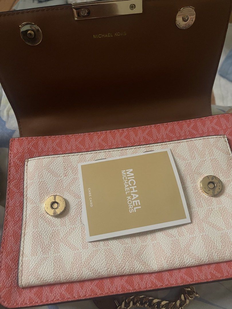 Michael Kors Multicolor Monogram Shoulder Bag (Category: Luxury Bags & Wallets) located in Manila. Submitted by truetiger.46b87f (Listing ID 1468709321, Image 2). Description: - Brand: Michael Kors - Design: Tri-color monogram print (Brown, Cream, Pink) - Hardware: Gold-tone with chain strap and clasp closure - Closure: Magnetic snap buttons under front flap - Interior: Clean brown leather lining - Inclusion: Original care card - Condition: Excel