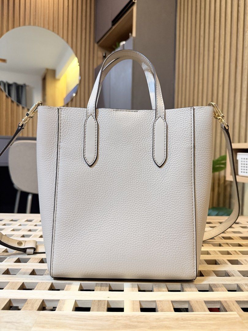 Michael Kors Tote (Category: Tote Bags) located in Pasig City. Submitted by mandks (Listing ID 1468640022, Image 3). Description: Michael Kors Tote 9.5/10 - my top pick! Interior slip pockets Suede interior Comes with an adjustable strap Matches any outfit 🫶🏼 ₱3,800 + shipping fee (J&T/Lalamove only).