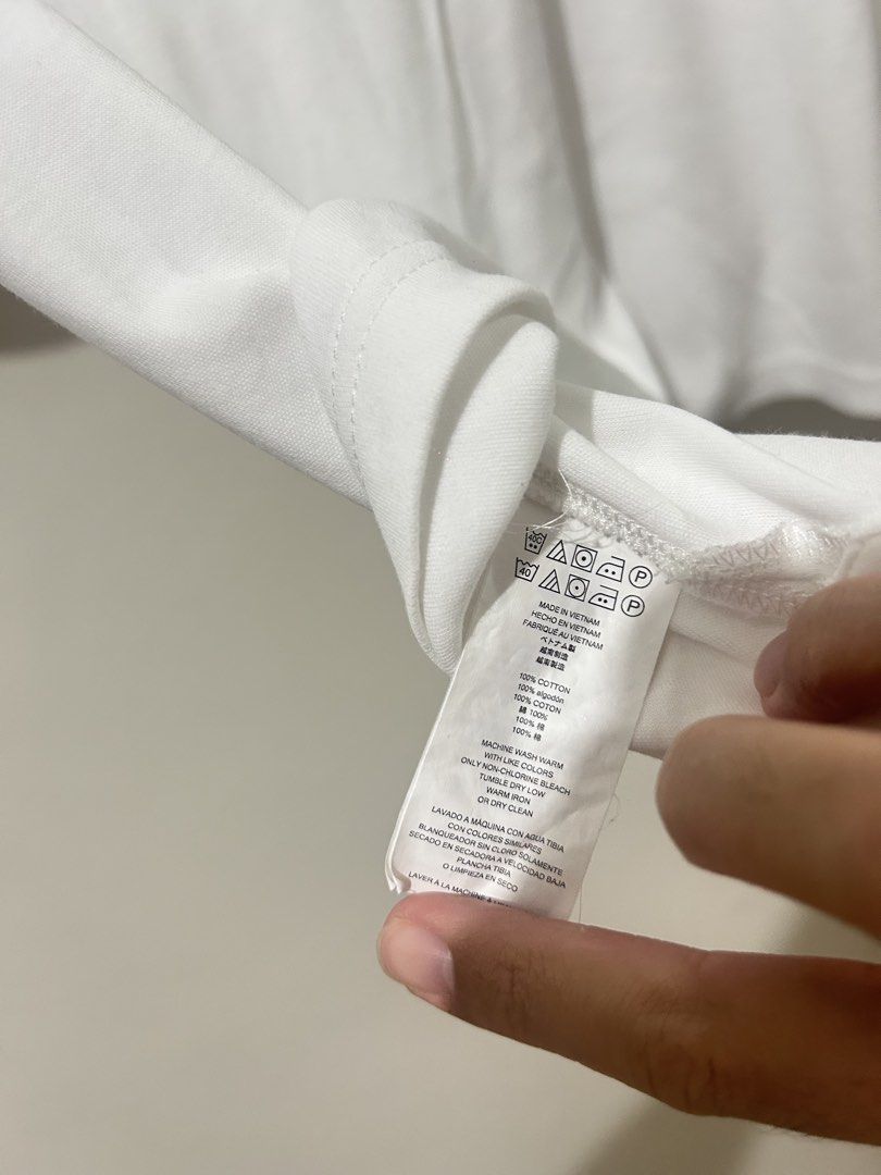 Michael Kors White Polo Shirt (Category: Tshirts & Polo Shirts ) located in Manila. Submitted by timo_clutters18 (Listing ID 1468573579, Image 3). Description: Michael Kors White Polo Shirt Size: M (24x23) Condition: 9/10 *stain on collar MOP: G-Cash/COD Location: Quezon City.