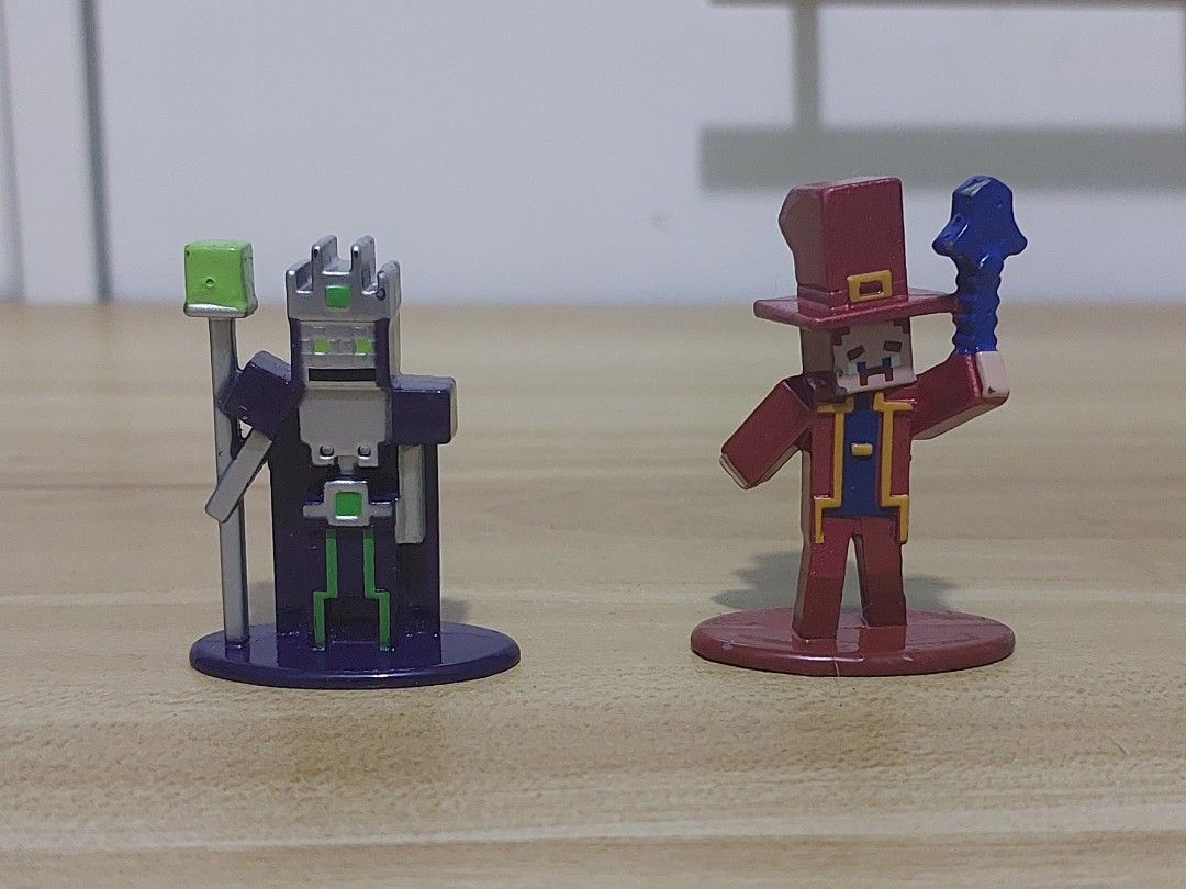 Minecraft Die-Cast Metal Collectible Figures Bundle (Category: Designer & Blind Box Toys) located in Quezon City. Submitted by pandajack0910.1 (Listing ID 1468562932, Image 2). Description: - Set of miniature Minecraft character figures with colorful display bases - Includes mobs, villagers, and armored players in blocky pixelated style - Made of solid metal with detailed painted finishes - Perfect desk ornaments or additions to any Minecraft col