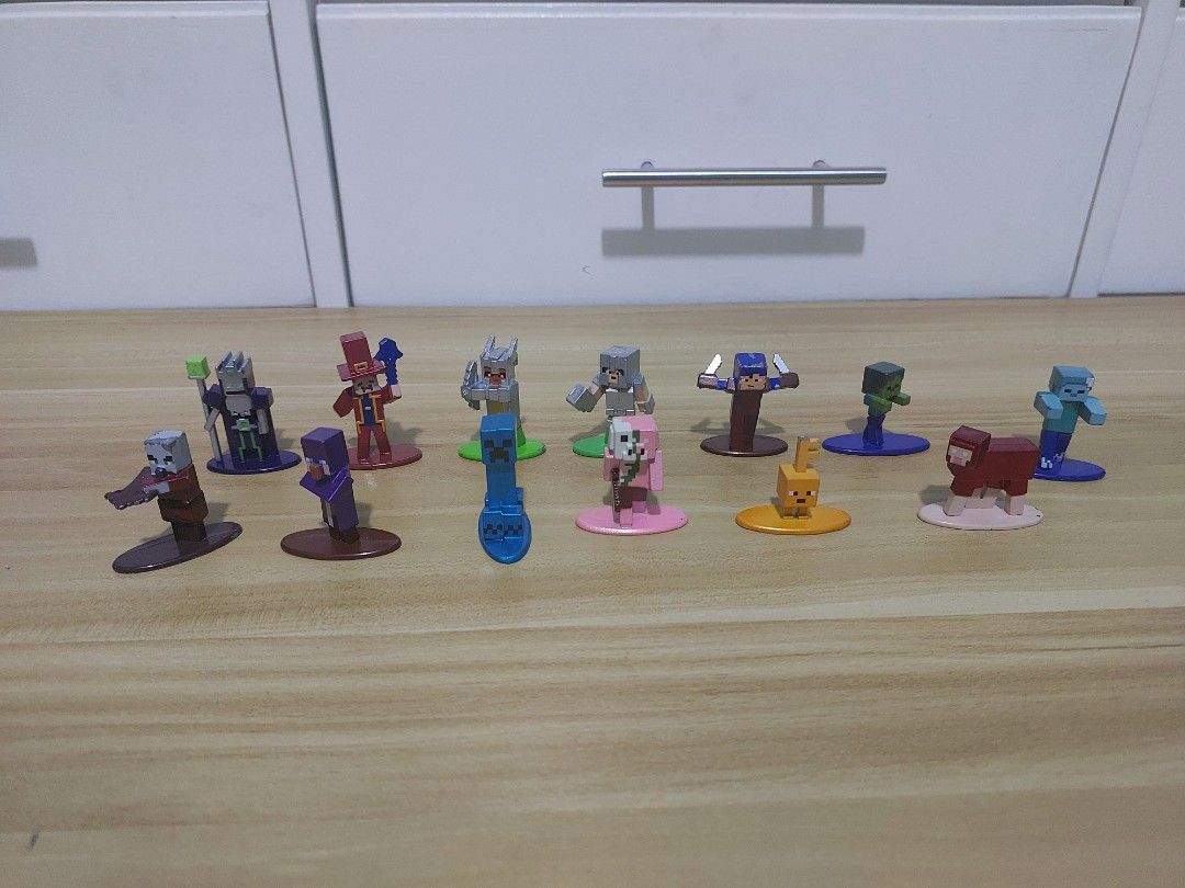 Minecraft Die-Cast Metal Collectible Figures Bundle (Category: Designer & Blind Box Toys) located in Quezon City. Submitted by pandajack0910.1 (Listing ID 1468562932, Image 1). Description: - Set of miniature Minecraft character figures with colorful display bases - Includes mobs, villagers, and armored players in blocky pixelated style - Made of solid metal with detailed painted finishes - Perfect desk ornaments or additions to any Minecraft col