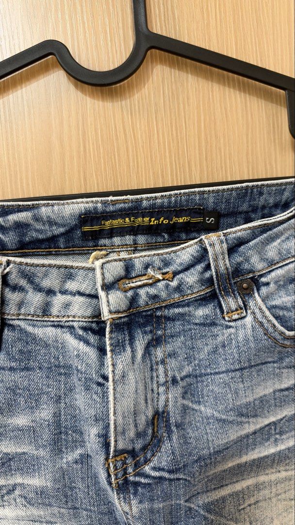 Mini Denim Skirt (Category: Skirts) located in Quezon City. Submitted by declutterw_v (Listing ID 1468681713, Image 2). Description: - Brand: Fantastic & Forever Info Jeans - Size: Small - Wash: Light wash denim with faded whiskering details - Design: Classic five-pocket style with front zipper and button closure - Hem: Trendy raw frayed hem.