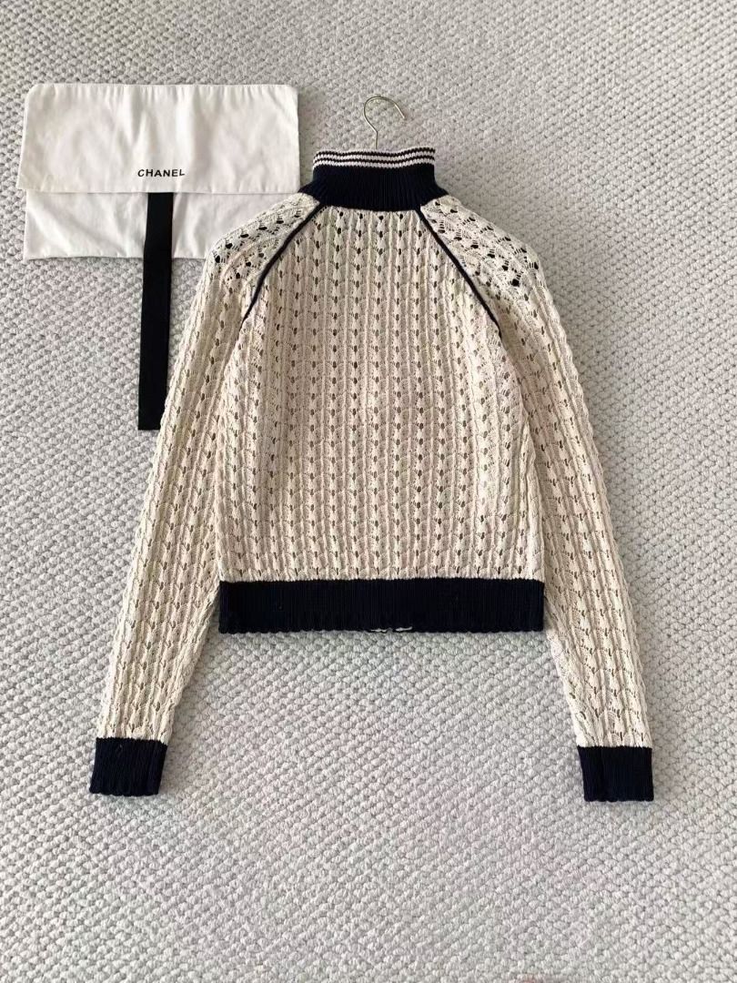 Miu Miu Knit Zip Up Cardigan (Category: Coats, Jackets and Outerwear) located in Malabon City. Submitted by ojaswibent53454 (Listing ID 1468556883, Image 3). Description: - Brand new cream crochet knit cardigan - Contrast navy blue ribbed collar, cuffs, and hem - Full front zipper closure - Signature Miu Miu logo patch on the chest - Long raglan sleeves with seam piping - Includes original hang tag and dust bag.