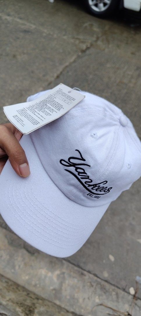 MLB New York Yankees White Baseball Cap (Category: Caps & Hats) located in Bulacan. Submitted by adrian2325 (Listing ID 1468602806, Image 1). Description: - Brand: MLB New York Yankees - Color: Clean white cotton - Design: Cursive 'EST. 1903' embroidery on the front - Fit: Adjustable strap at the back with premium metal buckle hardware - Condition: Brand new with inside tag and paper inserts still attached.