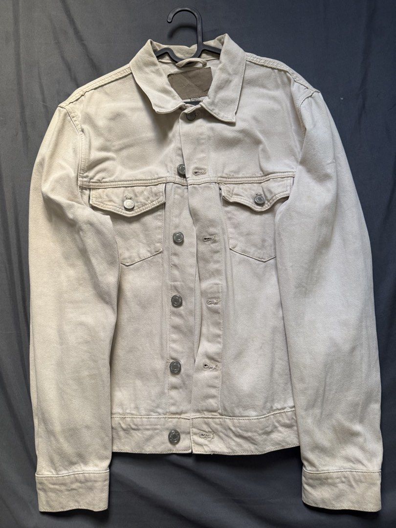 MNG Denim Off-White Denim Jacket Size M (Category: Coats, Jackets and Outerwear) located in Pasay City. Submitted by el.sole (Listing ID 1468570500, Image 1). Description: - Brand: MNG Denim - Color: Off-white - Size: M - Features: Classic structured fit, metal button closures on front, cuffs, and chest pockets - Style: Versatile, easy layering piece for year-round wear Please manage your expectations. Kindly expect signs of use and slightly fade