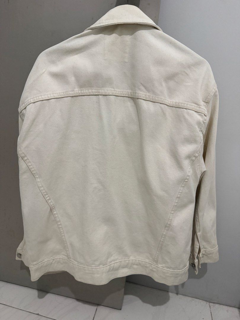 MNG White Denim Jacket Size XS (Category: Coats, Jackets and Outerwear) located in Mandaluyong City. Submitted by trovebya (Listing ID 1468594821, Image 2). Description: - Brand/Style: MNG denim jacket - Color: Off-white - Size: XS - Closure: Front button-up - Pockets: Two chest flap pockets and side slip pockets - Details: Classic collar neck style, made in Bangladesh - Condition: Clean look, versatile for casual outfits.