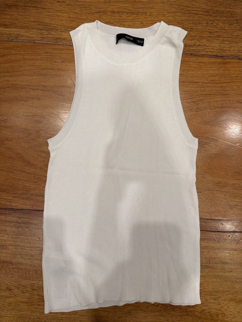 MNG White Ribbed Knit Tank Top Size S (Category: Sleeveless) located in Quezon City. Submitted by nic.man (Listing ID 1468657313, Image 1). Description: - Brand: MNG - Size: Small - Color: Clean white - Style: Crew neckline, sleeveless, basic ribbed tank top - Material: Stretchy, soft knit fabric - Condition: Excellent, no stains or damage.