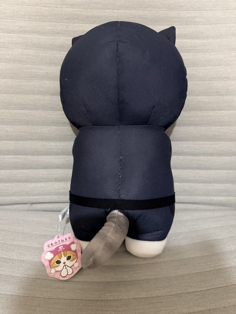 Mofusand Ninja Cat Stuffed Toy (Category: Plushies & Soft Toys) located in Pasig City. Submitted by thetravellingguyinstyle (Listing ID 1468689636, Image 2). Description: - Authentic Mofusand stuffed toy - Dressed in a cool black ninja outfit with Japanese kanji on the forehead hood - Features a cute grey tail at the back and tucked white paws in front - Made with ultra-soft, huggable material - Brand new with tag - From Tokyo Japan.