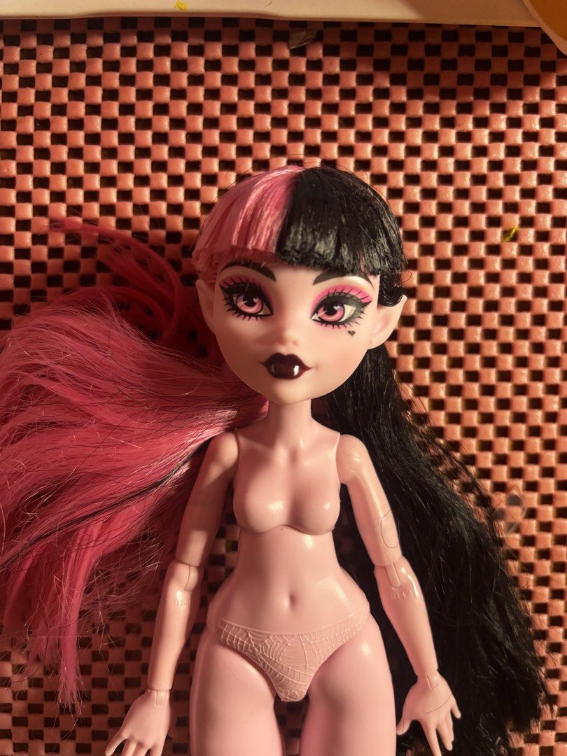 Monster High G3 Nude CORE Draculaura Doll (Category: Figurines & Statues) located in Andop. Submitted by fammie_frayyss (Listing ID 1468695556, Image 3). Description: - Character: Monster High Generation 3 Draculaura - Hair: Pink and black split hair with bangs (tied back for safety) - Face: Pink eye makeup and cute fangs - Body: Fully articulated with molded pink spiderweb underwear - Condition: Clean, pre-loved - Inclusions: Sold nude (no cloth