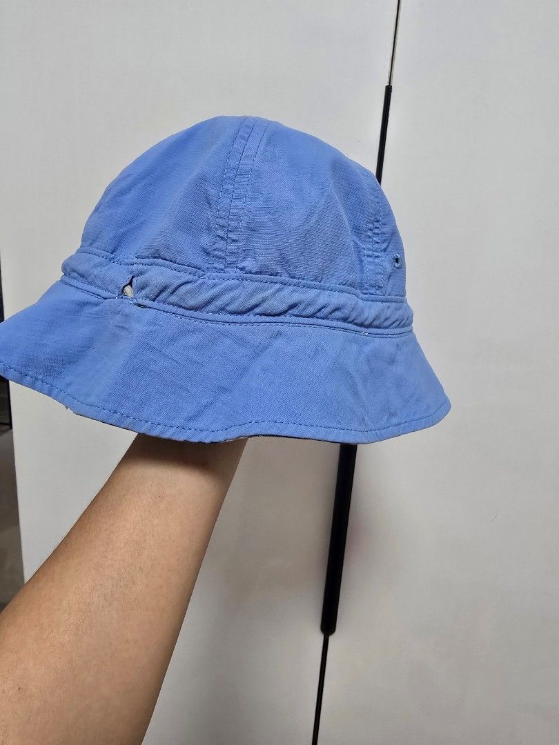 Mont-bell Reversible Toddler's Bucket Hat (Category: Babies & Kids Fashion) located in Pasig City. Submitted by jam1ekow (Listing ID 1468546987, Image 2). Description: reversible with inner adjustble strap light stain but not obvious due to storage in d cabinet.