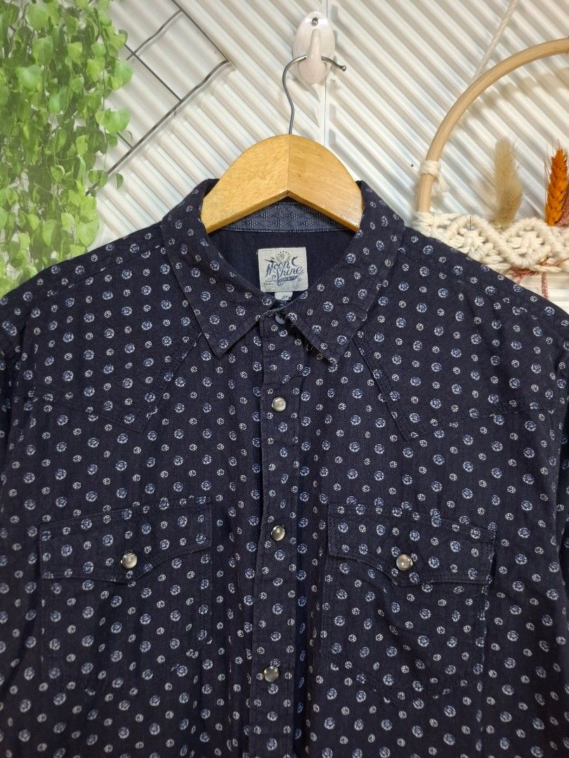 Moon Shine Long Sleeve Button-Up Shirt (Category: Sets & Coordinates) located in Bulacan. Submitted by cathycampo51092 (Listing ID 1468616682, Image 1). Description: Moon Shine button-up shirt in navy blue with an all-over geometric dot pattern. Long sleeves, dual chest pockets with snap buttons, and snap closures down the front. Size M to L. Measurements: 22 inches chest width, 29 inches length. Clean pattern, easy to style for casual days..