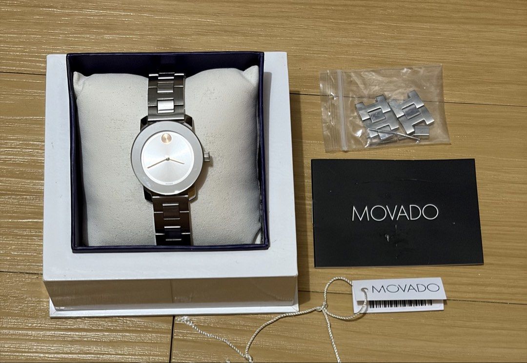 Movado Bold Silver Dial Ladies Watch (Category: Women's Watches) located in Quezon City. Submitted by beckyshop2024 (Listing ID 1468588628, Image 2). Description: - Used twice - In mint condition - 30mm; Stainless steel; 30m water resistant; Scratch resistant K1 Mineral; Swiss movement - Silver-toned metallic sunray dial with a signature rose-gold-toned flat dot at 12 o'clock and matching rose-gold hands - Note: Few scratches on the side (refer t