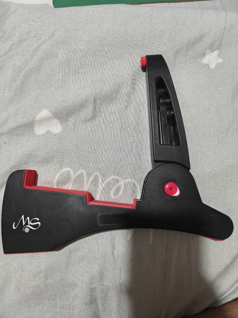 MS Portable Folding Guitar Stand (Category: Musical Instruments) located in Caloocan City. Submitted by mackenzie001 (Listing ID 1468667829, Image 1). Description: - Portable folding guitar stand in stylish black and red - Features the MS brand logo stamped on the side - Folds completely flat for hassle-free storage and transport - Equipped with rubber padding to protect your instrument from scratches - Solid and reliable build suitable for both 