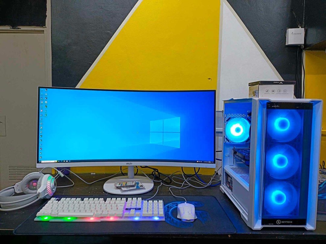 MSI Curved Monitor Keytech PC Gaming Setup (Category: Desktops) located in Caloocan City. Submitted by christykarla69 (Listing ID 1468705656, Image 3). Description: - Complete gaming and productivity setup ready to use - MSI curved monitor for an immersive visual experience - Aesthetic white Keytech case equipped with cool blue fans - RGB glowing keyboard and matching white mouse included - Comfortable headphones included for gaming audio - Fully