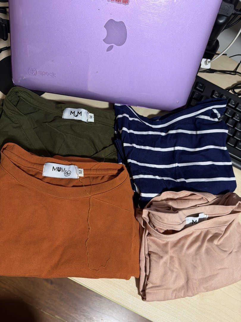 MUM & ME Maternity T-Shirt Bundle Size M (Category: Shirts) located in Manila. Submitted by hflores_23 (Listing ID 1468547338, Image 1). Description: - Brand: MUM - Size: Medium (M) - Quantity: Bundle of 4 tops - Colors: Olive green, terracotta orange, navy blue with white stripes, dusty pink - Features: Double-layered front design for easy nursing access and growing bump - Fabric: Soft cotton stretch for maximum comfort - Condition: Minimal wear