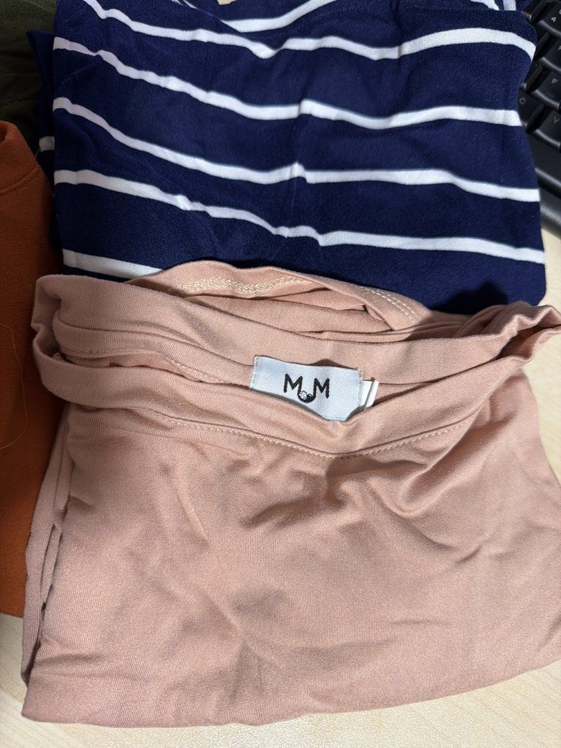 MUM & ME Maternity T-Shirt Bundle Size M (Category: Shirts) located in Manila. Submitted by hflores_23 (Listing ID 1468547338, Image 3). Description: - Brand: MUM - Size: Medium (M) - Quantity: Bundle of 4 tops - Colors: Olive green, terracotta orange, navy blue with white stripes, dusty pink - Features: Double-layered front design for easy nursing access and growing bump - Fabric: Soft cotton stretch for maximum comfort - Condition: Minimal wear