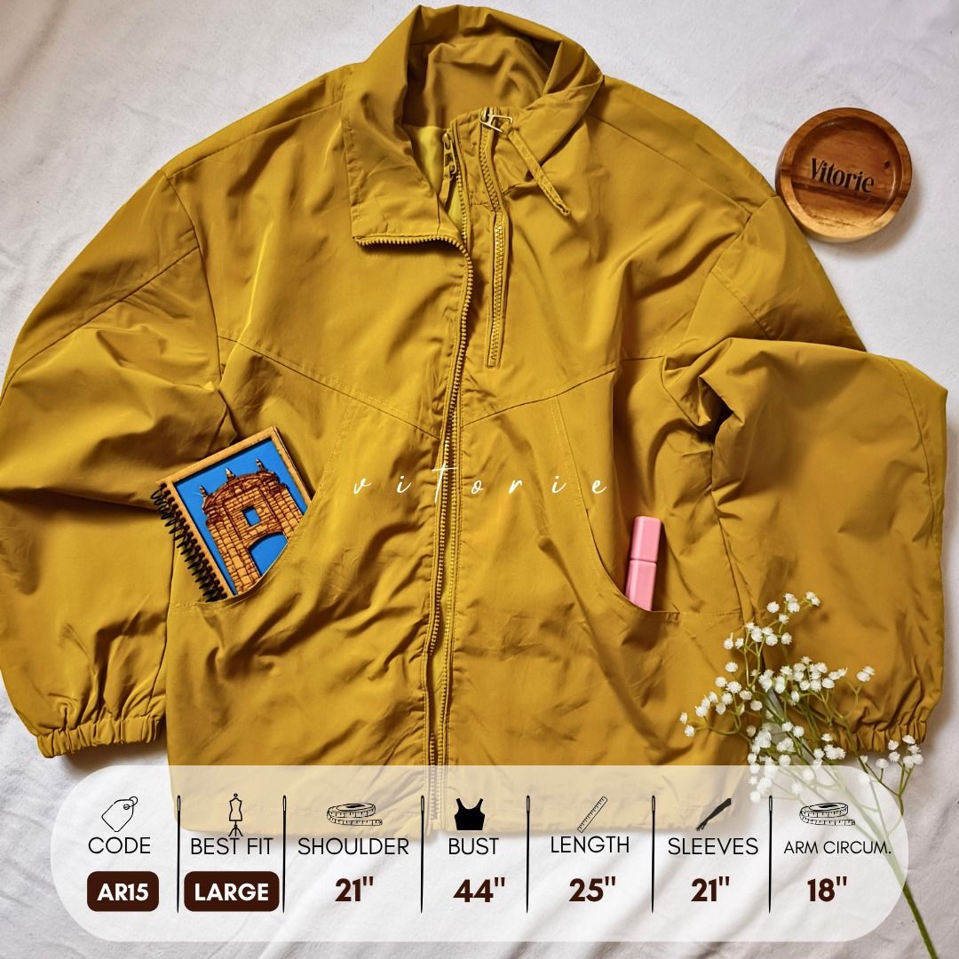 Mustard Yellow Zip-Up Jacket Large (Category: Coats, Jackets and Outerwear) located in Cabuyao City. Submitted by vitorieclothing_lifestyle (Listing ID 1468506374, Image 1). Description: - Color: Mustard yellow - Closure: Front zip with stand collar - Pockets: Two front pockets - Fit: Relaxed fit with elastic cuffs and hem - Measurements: Shoulder 21", Bust 44", Length 25", Sleeves 21", Arm circumference 18" - Product Code: AR15.