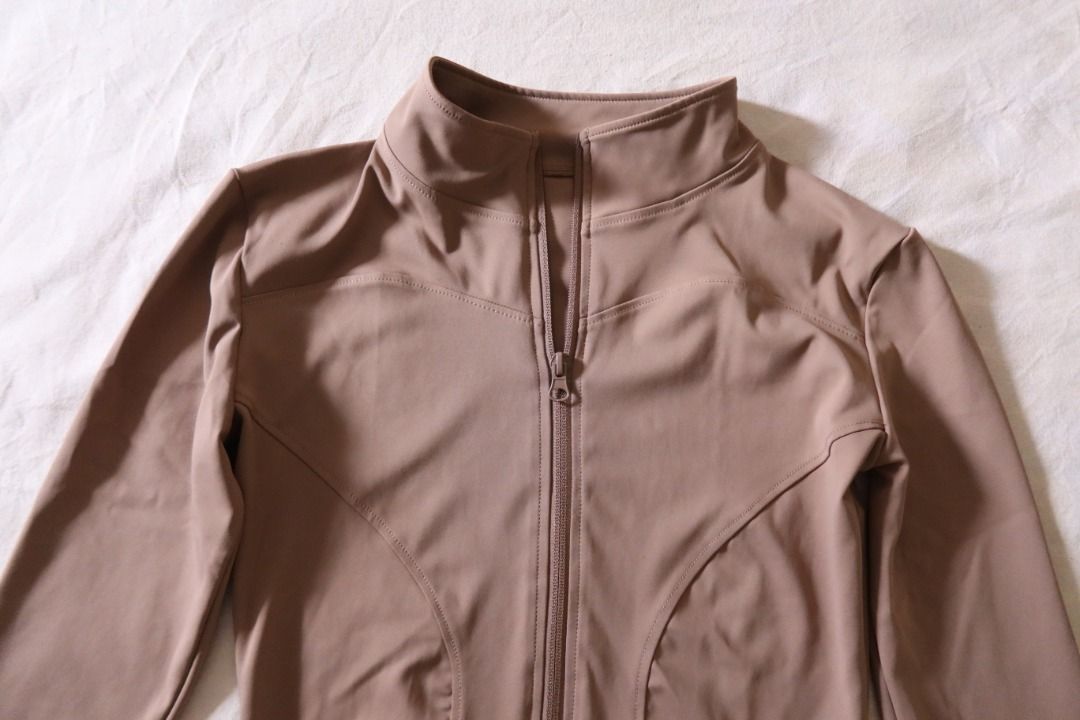 Muted brown zip-up sports jacket (Category: Coats, Jackets and Outerwear) located in Manila. Submitted by imama23 (Listing ID 1468533638, Image 2). Description: - Color: Muted brown / earth tone - Material: Smooth, stretchy performance fabric - Ideal for: Activewear, gym sessions, yoga, or stylish athleisure outfits Condition: 9/10, rarely used Size: M (but best fits XS-S) Location: Manila Shipping - Payment first before shipping - J&T, Grab, Lal
