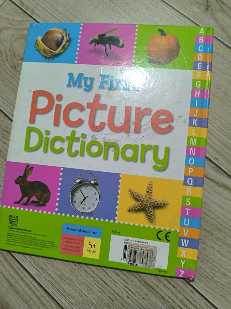 My First Picture Dictionary by Sarah Phillips (Category: Children's Books) located in Manila. Submitted by chayieinkie (Listing ID 1468707050, Image 2). Description: - Title: My First Picture Dictionary by Sarah Phillips - Publisher: Castle Street Press - Format: Hardcover with colorful illustrations - Features: Handy alphabet tabs on the side for easy navigation - Age Range: Recommended for kids 5 years and up - Benefits: Perfect for learning ba