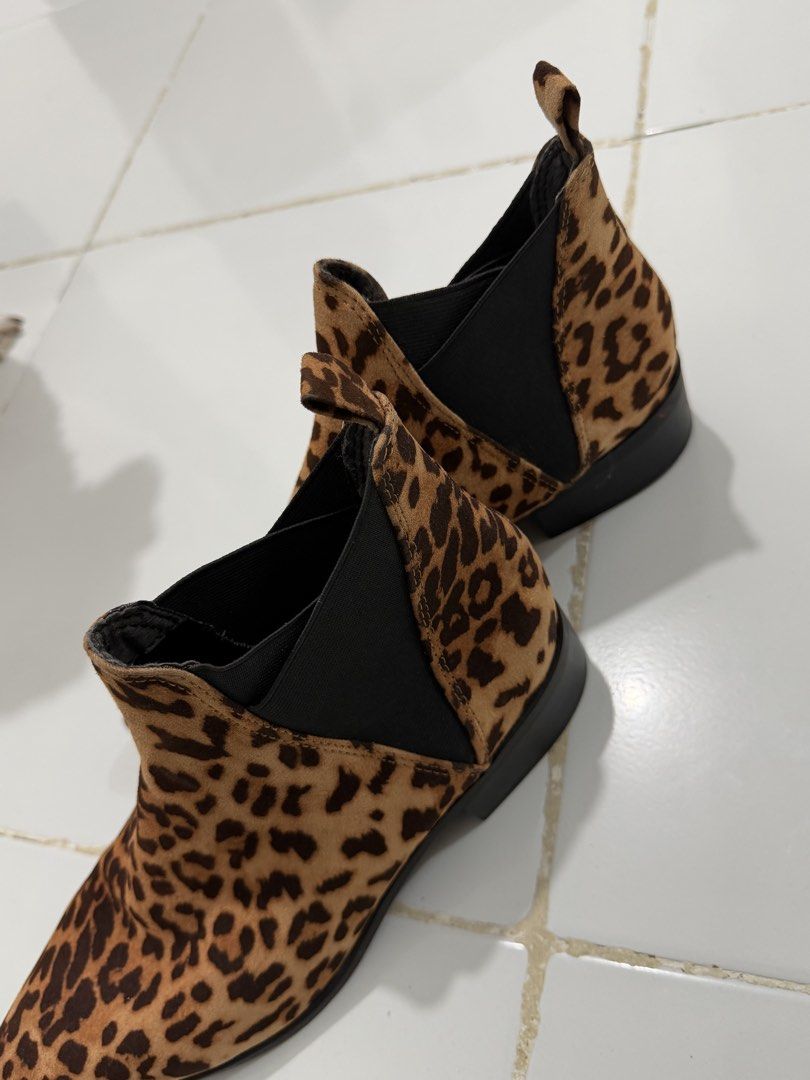 MYLU Leopard Print Pointed Toe Ankle Boots (Category: Boots) located in Manila. Submitted by xiestyleclothing (Listing ID 1468649904, Image 2). Description: - Brand/Model: MYLU Ankle Boots - Pattern: Classic leopard print - Design: Slip-on with black elastic side gore panels and heel pull tabs - Shape: Pointed toe silhouette - Heel: Low block heel - Style: Super stylish statement shoes, great for dressing up any outfit.