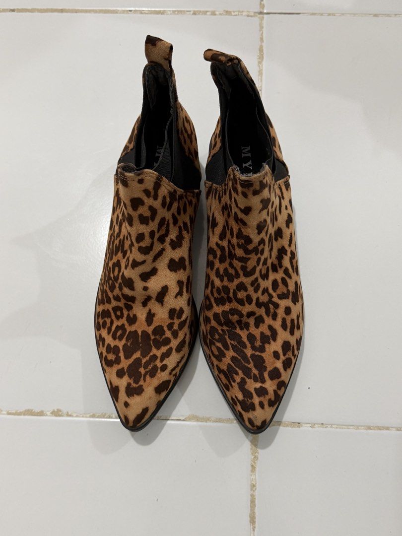 MYLU Leopard Print Pointed Toe Ankle Boots (Category: Boots) located in Manila. Submitted by xiestyleclothing (Listing ID 1468649904, Image 1). Description: - Brand/Model: MYLU Ankle Boots - Pattern: Classic leopard print - Design: Slip-on with black elastic side gore panels and heel pull tabs - Shape: Pointed toe silhouette - Heel: Low block heel - Style: Super stylish statement shoes, great for dressing up any outfit.