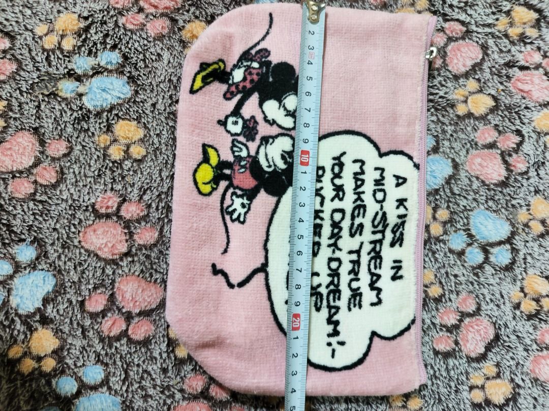 Nano Universe Mickey Mouse Pink Pouch (Category: Purses & Pouches) located in San Leonardo. Submitted by burgossanleonardo.12345 (Listing ID 1468648278, Image 3). Description: - Authentic Nano Universe pouch - Color: Pink front, off-white canvas back - Cute Mickey & Minnie graphic with vintage quote - Printed Nano Universe logo on the back - Dimensions: approx. 14 cm (H) x 23 cm (W) - Secure top zip closure.