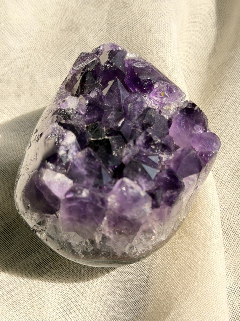 Natural Amethyst Crystal Cluster (Category: Precious Stones) located in Paranaque City. Submitted by heyandeey (Listing ID 1468510148, Image 2). Description: - Stunning deep violet amethyst crystal cluster - Features clear, pointed quartz formations - Beautiful polished outer edge - Catches the light wonderfully - Solid weight, perfect for desk or shelf display.