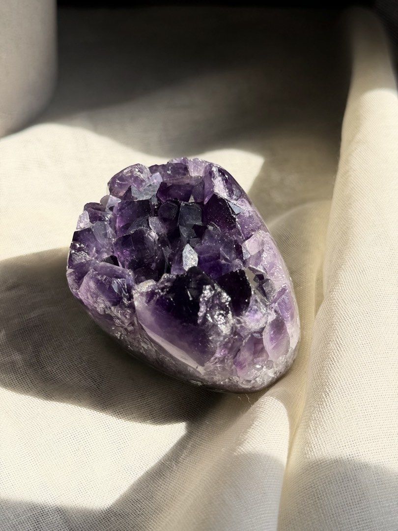 Natural Amethyst Crystal Cluster (Category: Precious Stones) located in Paranaque City. Submitted by heyandeey (Listing ID 1468510148, Image 1). Description: - Stunning deep violet amethyst crystal cluster - Features clear, pointed quartz formations - Beautiful polished outer edge - Catches the light wonderfully - Solid weight, perfect for desk or shelf display.