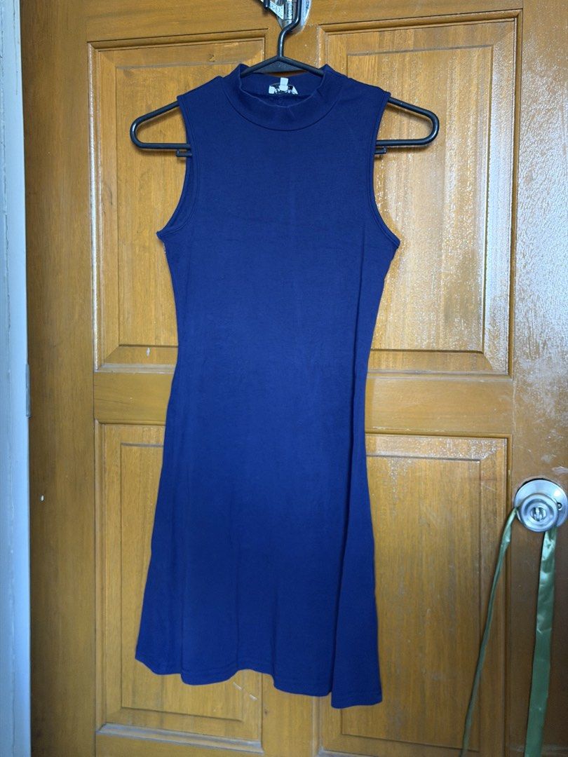 navy blue dress (Category: Dresses) located in Paranaque City. Submitted by heygabbie (Listing ID 1468631383, Image 1). Description: - Color: Blue - Style: Sleeveless with a mock neckline - Fit: Fitted silhouette, stretchy fabric - Length: Above the knee - Perfect for: Casual everyday wear, easily styled with sneakers or sandals.