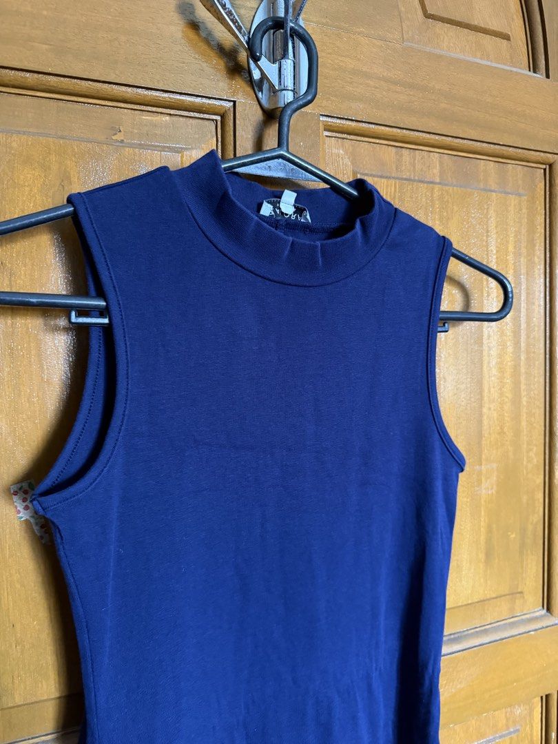 navy blue dress (Category: Dresses) located in Paranaque City. Submitted by heygabbie (Listing ID 1468631383, Image 2). Description: - Color: Blue - Style: Sleeveless with a mock neckline - Fit: Fitted silhouette, stretchy fabric - Length: Above the knee - Perfect for: Casual everyday wear, easily styled with sneakers or sandals.