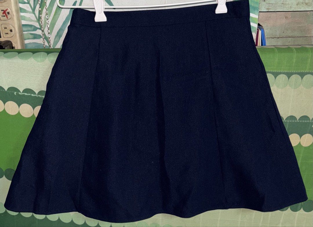 Navy Blue Flared Skirt (Category: Skirts) located in Manila. Submitted by whatspoppin3000 (Listing ID 1468586027, Image 1). Description: - Color: Dark navy blue - Silhouette: Classic flared shape with structured panels - Waist: High waistband for a flattering fit - Hemline: Clean, polished finish - Styling: Solid color makes it easy to mix and match with various tops.