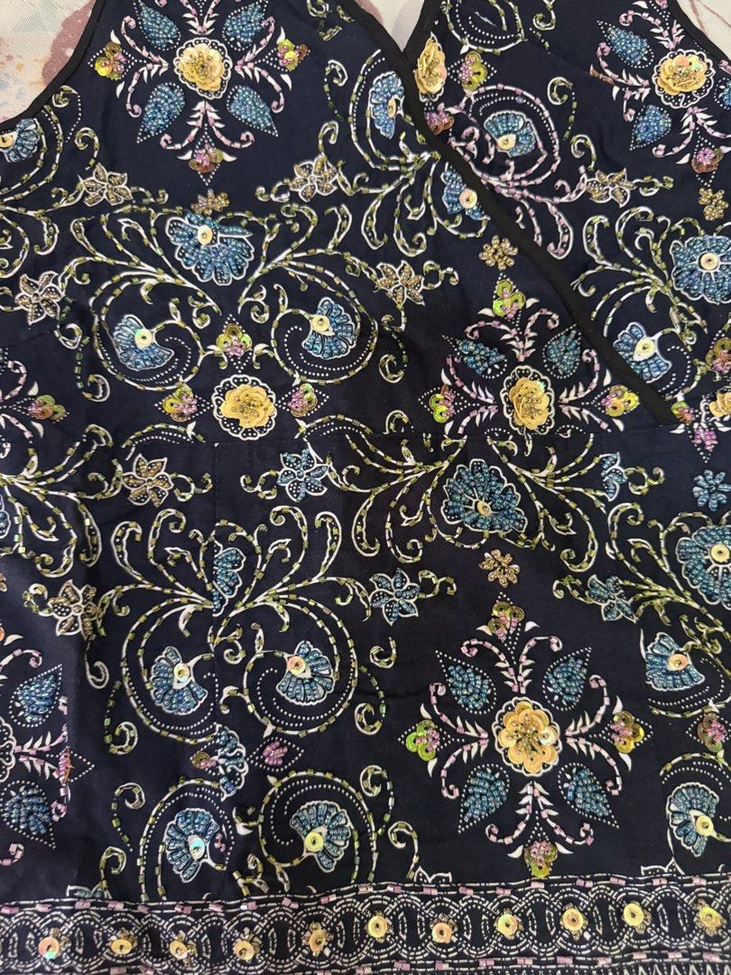 Navy blue floral beaded sequin halter top (Category: Sleeveless) located in Cebu City. Submitted by hotchkisscebu (Listing ID 1468703536, Image 2). Description: - Color: Dark blue with intricate floral prints and sparkly sequins - Fit: Halter neck tie with heavy smocked back for extra stretch and comfort - Style: Chic, trendy, and eye-catching - Occasion: Ideal for casual nights out, beach trips, or summer parties - Condition: Brand new / Excelle