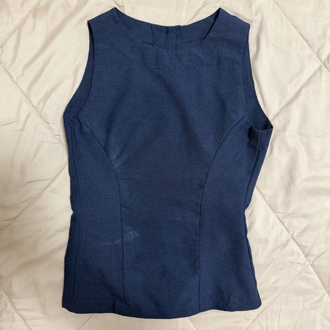 Navy Blue Sleeveless Top with Back Buttons (Category: Sleeveless) located in Manila. Submitted by choccccc (Listing ID 1468642822, Image 2). Description: - customized to fit - Fitted waist with subtle curved panel seams for a flattering shape - For a chic business casual/corporate look.