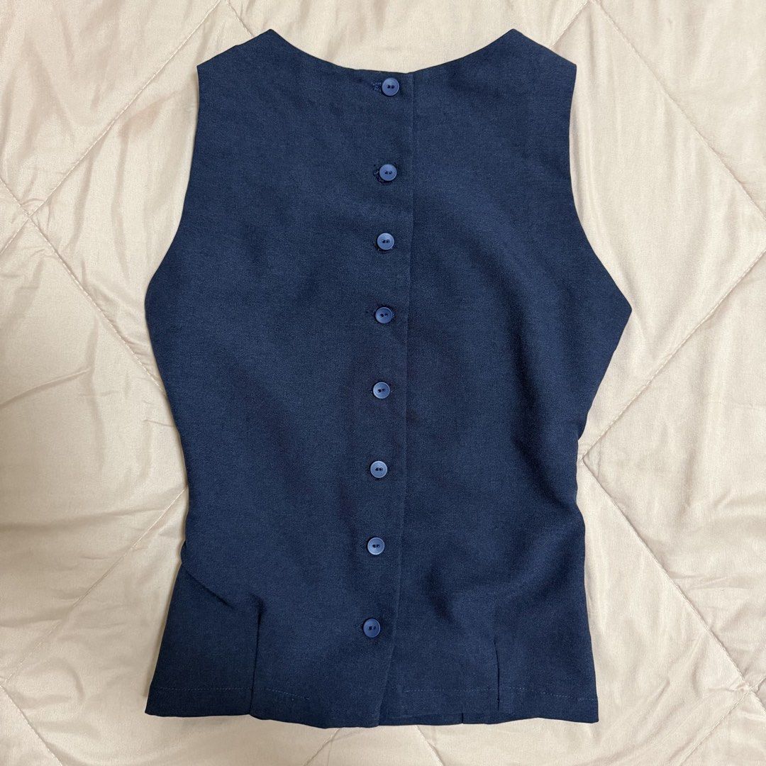 Navy Blue Sleeveless Top with Back Buttons (Category: Sleeveless) located in Manila. Submitted by choccccc (Listing ID 1468642822, Image 1). Description: - customized to fit - Fitted waist with subtle curved panel seams for a flattering shape - For a chic business casual/corporate look.