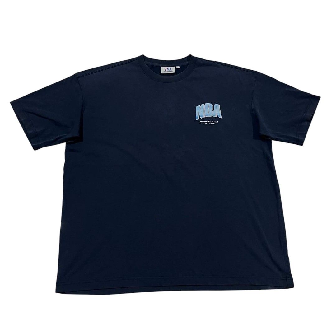 NBA Dark Blue T-Shirt (Category: Tshirts & Polo Shirts ) located in Cagayan de Oro. Submitted by lootfindzzzz (Listing ID 1468620075, Image 1). Description: - Color: Dark blue - Design: Small gradient blue NBA logo on the chest - Fit: Relaxed fit with short sleeves and a crew neck - Comfort: Soft, breathable fabric ideal for daily wear - Authenticity: Features official NBA branding on the inside collar tag.