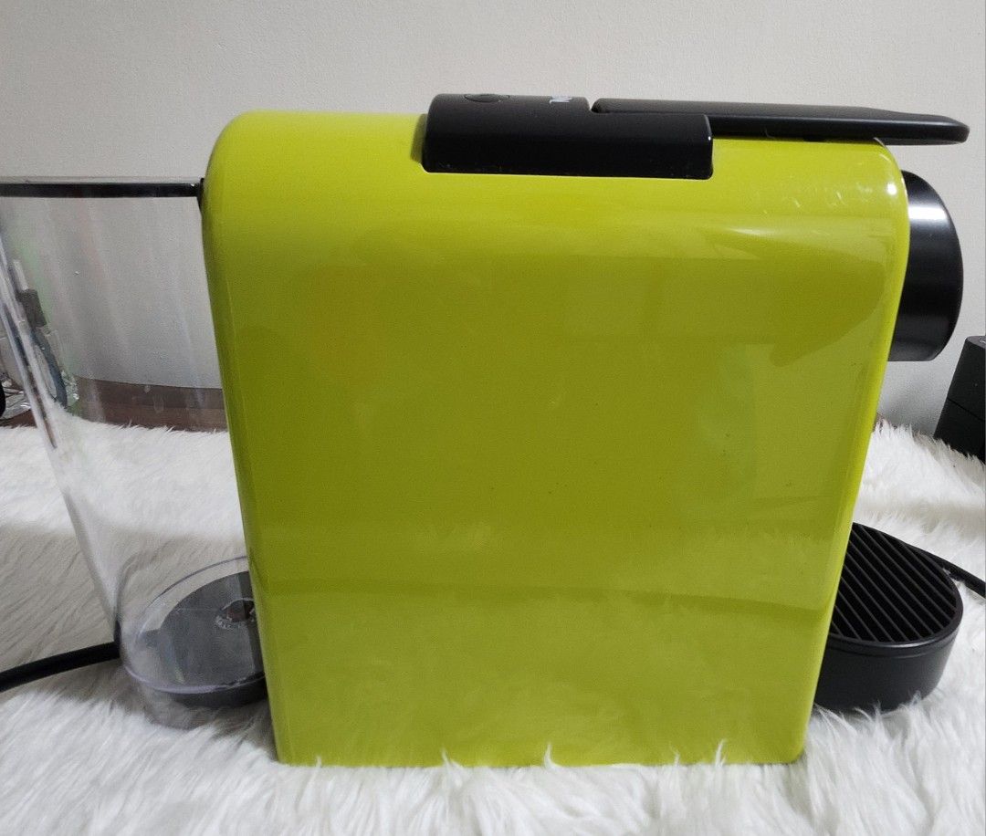 Nespresso Essenza Mini Coffee Maker (Category: Coffee Machines & Makers) located in Taytay. Submitted by luxebagcray (Listing ID 1468577736, Image 3). Description: - Model: Nespresso Essenza Mini Coffee Maker D30 - Color: Vibrant lime green - Design: Compact and space-saving for any countertop - Compatibility: Works with standard Nespresso capsules - Features: Easy-to-use top buttons for cup size selection - Inclusions: Clear water tank, removabl