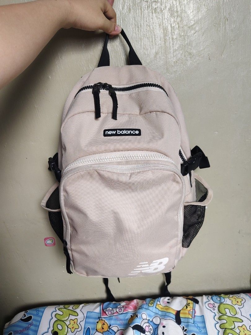 New Balance Beige Backpack with Front Pocket (Category: Backpacks) located in General Mariano Alvarez. Submitted by findsandmoreph (Listing ID 1468647724, Image 1). Description: - Authentic New Balance beige canvas backpack - Spacious main zip compartment for daily essentials - Front zippered pocket with built-in mesh organization - Dual side mesh water bottle holders - Padded mesh back panel for all-day comfort - Adjustable shoulder straps with 
