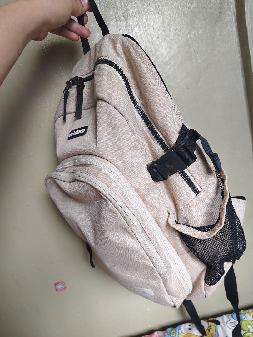 New Balance Beige Backpack with Front Pocket (Category: Backpacks) located in General Mariano Alvarez. Submitted by findsandmoreph (Listing ID 1468647724, Image 3). Description: - Authentic New Balance beige canvas backpack - Spacious main zip compartment for daily essentials - Front zippered pocket with built-in mesh organization - Dual side mesh water bottle holders - Padded mesh back panel for all-day comfort - Adjustable shoulder straps with 
